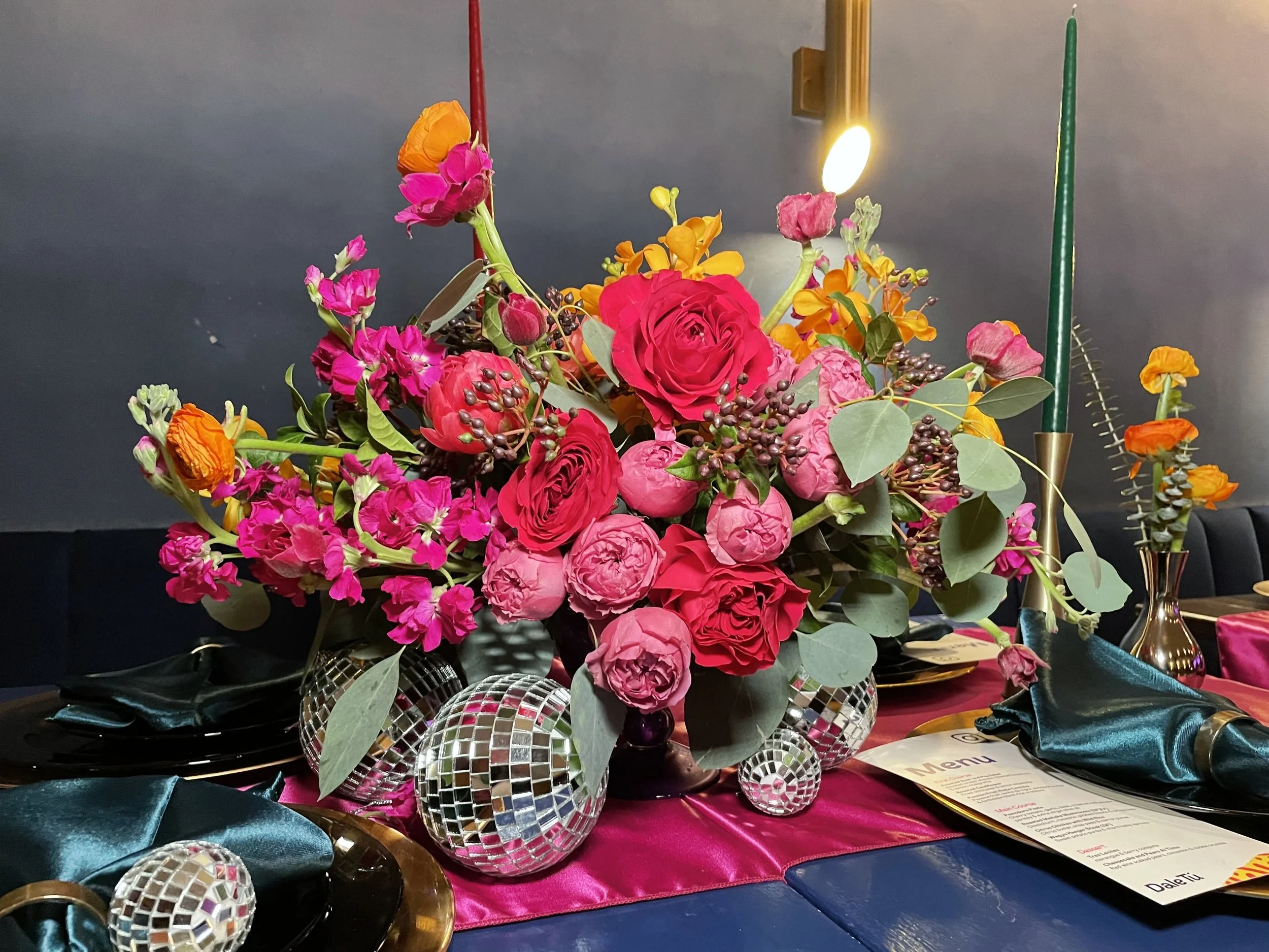 Floral designer preparing a detailed custom flower arrangement