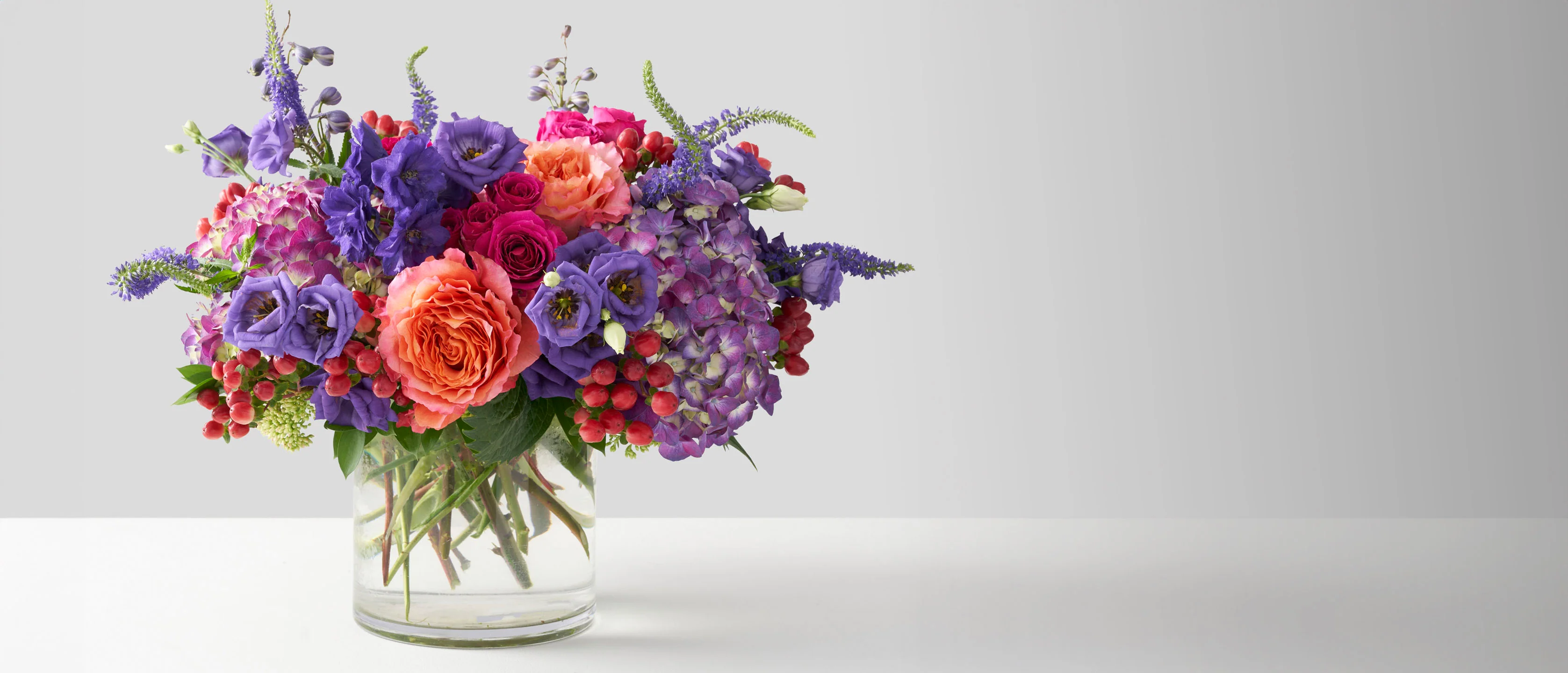 Beautiful gift bouquet arranged with fresh flowers and greenery