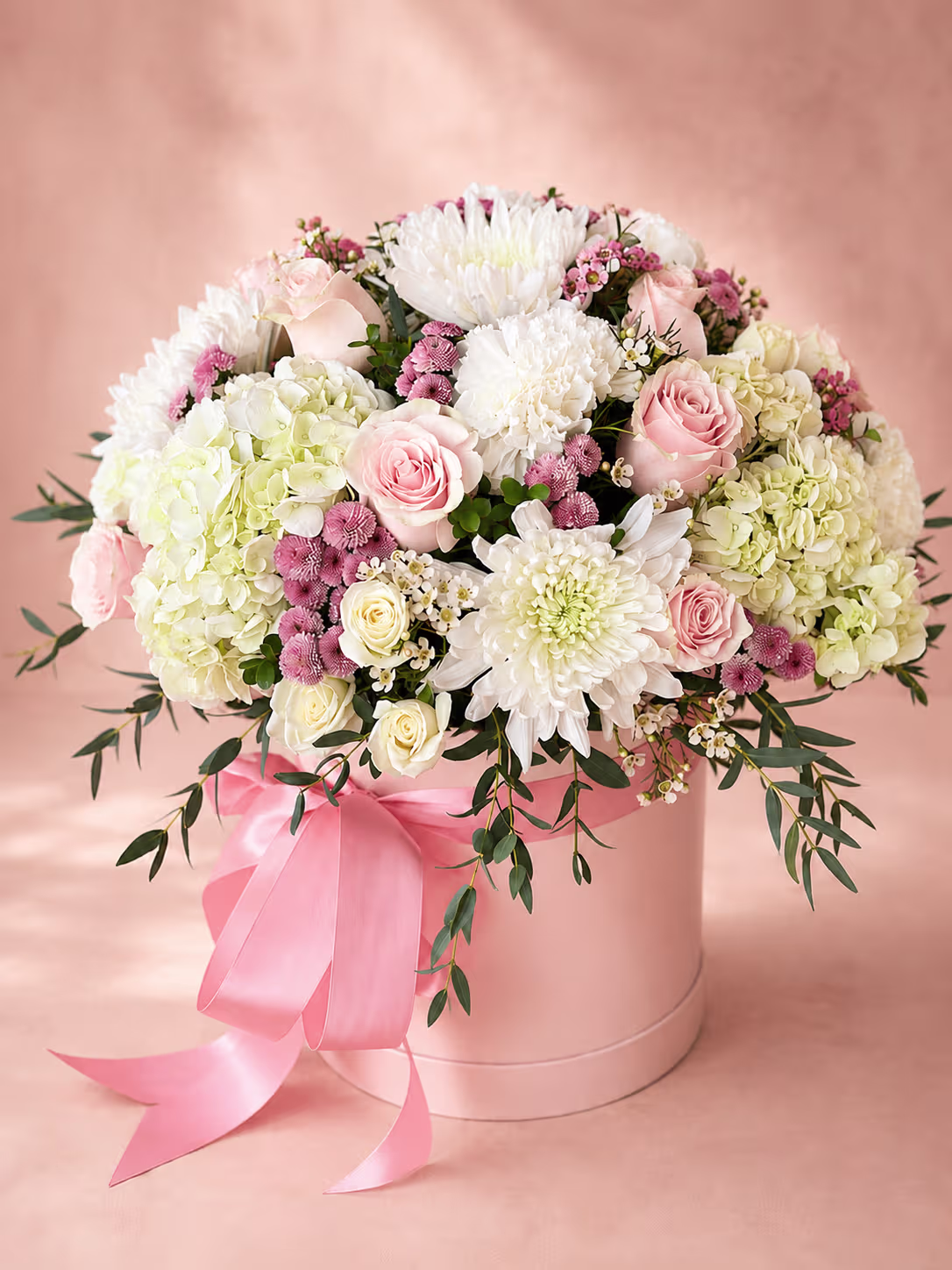 Floral designer arranging fresh flowers into a bouquet